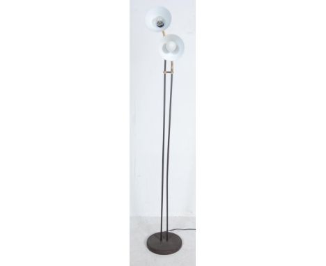 A retro vintage 20th century twin headed spot lamp having metal twin column supports raised on a circular base. The lamp has 