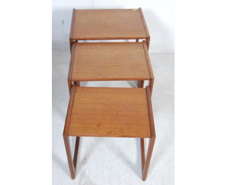 G Plan - A retro vintage 1960s teak wood nest of graduating tables having chamfered edges on a square top raised on quadrille