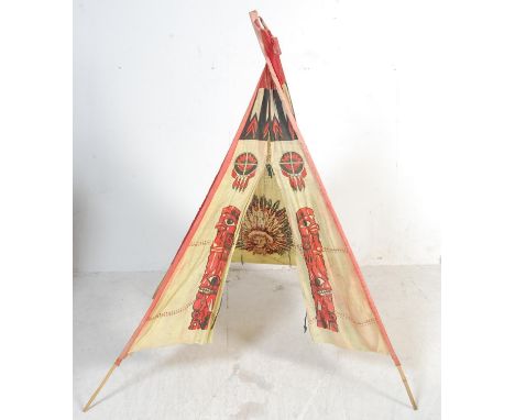 A vintage retro 20th century&nbsp;Native American Teepee tent. The tent of a pyramidal form with native Indian motif decorati