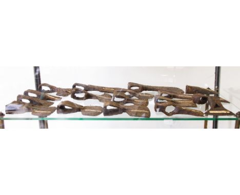 A COLLECTION OF FOURTEEN IRON AXE HEADS, to include a Celtic socketed type and various other types from 5th century onwards  