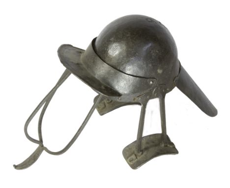 A RARE ENGLISH CIVIL WAR PERIOD SIEGE HELMET, of heavily blackened iron construction, two piece rounded skull with three bar 