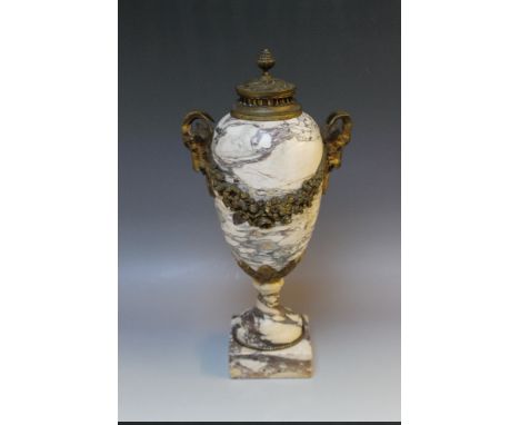 A HEAVY BRONZE MOUNTED MARBLE URN, circa 19th century with nicely detaild ram's head masks and floral swag decoration to the 