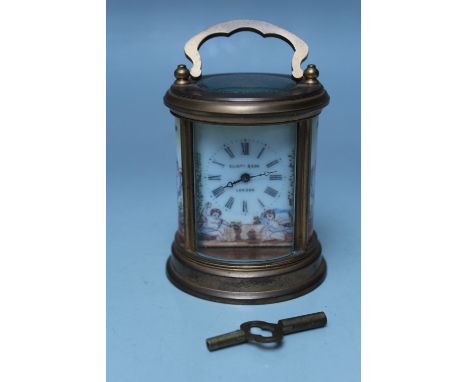 AN 'ELLIOTT & SON, LONDON' BRASS CASED MINIATURE CARRIAGE CLOCK, circular form, enamel face with Roman numerals and outer min