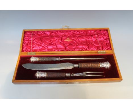 A CASED SILVER MOUNTED THREE PIECE BONE HANDLED CARVING SET BY HARRISON BROTHERS AND HOWSON - SHEFFIELD 1899, the mounts bein