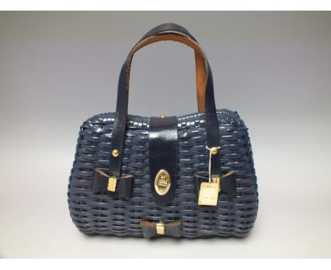 A STYLISH 1950S NAVY BASKET WEAVE  HANDBAG WITH LEATHER BOW EMBELLISHMENT, by Carole Joanne Fashions, G.C. Murphy Co., Hong K