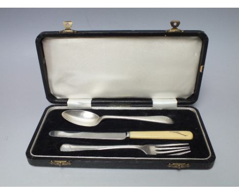 A CASED SILVER CHRISTENING SET, the spoon and fork with Birmingham hallmarks for 1959, all three personalised 'James'