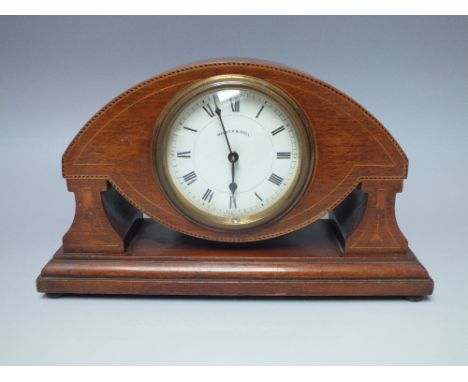 AN EDWARDIAN MAHOGANY INLAID FRENCH MANTEL CLOCK, the white enamel dial with Roman numerals, marked with retailers name 'Walk