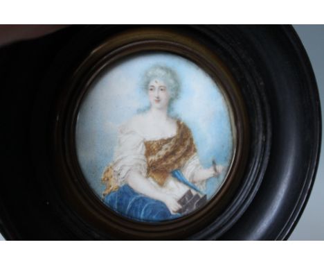 ENGLISH SCHOOL (NINETEENTH CENTURY). Miniature portrait of a young lady in classical dress, watercolour on ivory, framed, Dia