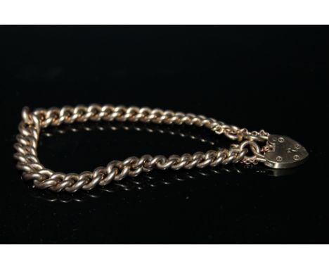 A HALLMARKED 9 CARAT GOLD GRADUATED CURB LINK GATE BRACELET, approx weight 32 g