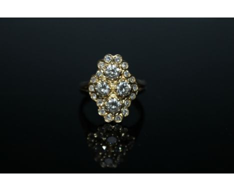 A BRILLIANT CUT DIAMOND RING, set with four brilliant cut diamonds totalling approx 0.92 carat surrounded by eighteen smaller