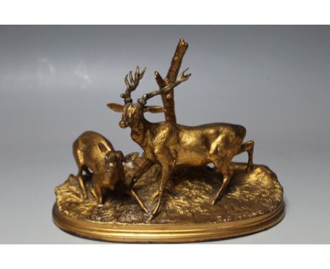 PIERRE JULES MENE - A GILT TABLE BRONZE, depicting a Stag and Doe on a natralistic style base, W 18.5 cm