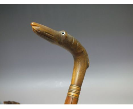 A 19TH CENTURY WALKING STICK WITH CARVED HORN HANDLE, in the form of  a greyhound, overall L 87.5 cm