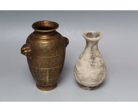 A SMALL CHINESE BRONZE BALUSTER VASE, decorated with geometric designs, crude lion head handles, H 14.5 cm, together with a c