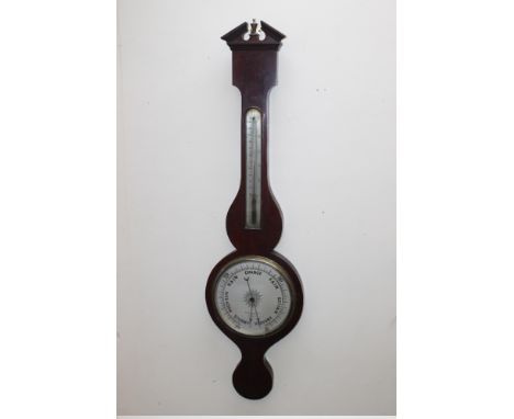 A LATE 19TH CENTURY MAHOGANY WHEEL BAROMETER, the silvered dial named to 'Benetfink & Co Ltd, Cheapside, London', H 99 cm