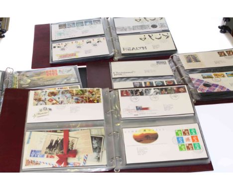 Four albums of first day covers