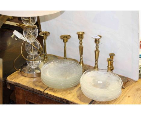 Brass candlesticks, glass plates and table lamp