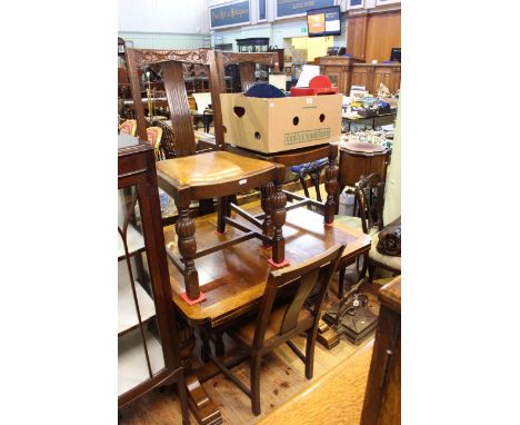 1930's oak draw leaf dining table and four chairs together with a carved oak buffet sideboard