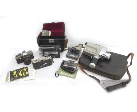 A group of vintage cameras and camcorders, including a Polaroid Instamatic camera, some with original cases and manuals. (6) 