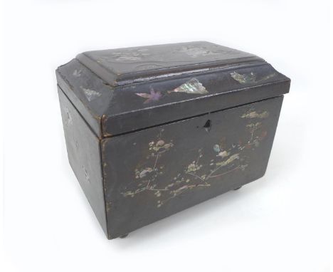 A 19th century chinoiserie tea caddy of sarcophagus form, with mother of pearl inlaid floral and relief decoration, two lidde