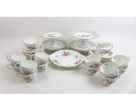 A Royal Crown Derby part tea set in the Derby Posies pattern, comprising twelve tea cups, twelve saucers, twelve tea plates, 