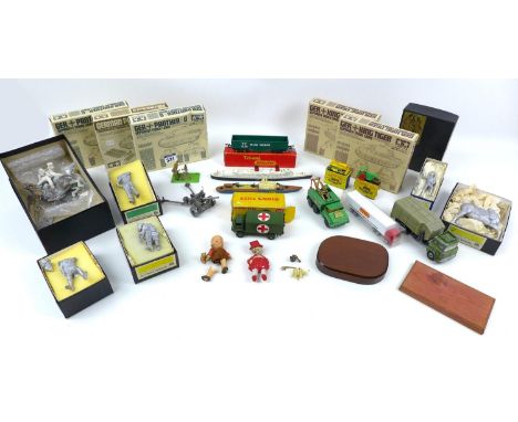 A group of military die-cast model toys, including a Dinky Military Ambulance (626), a Britains British army mortar model, fi