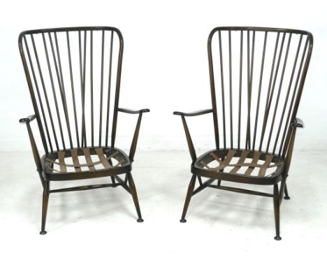 A pair of Ercol dark stained armchairs, 'Tall Back Easy Chair', model 478, in Old Colonial Antique colour, each, 72.5 by 82.5