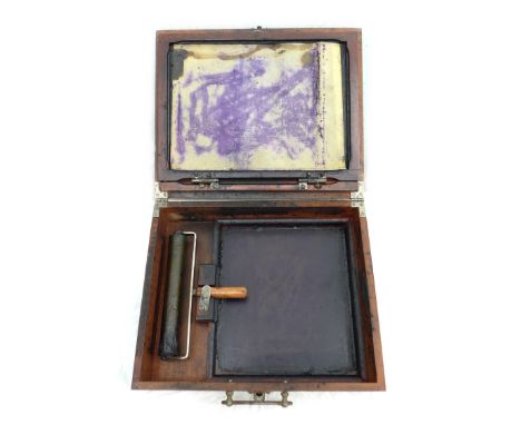 A Lion Menucator, No 2 model, portable duplicator, in mahogany case, with original ink roller, 30.5 by 25 by 11.5cm.
