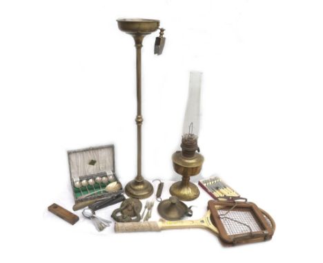 A mixed group of metal wares and other items, including a brass cigarette ashtray stand, an oil lamp, vintage tennis racket, 