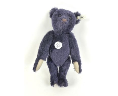 A 1998 Steiff replica 1909 dark blue teddy bear, 35cm high with growler, a certificate numbered 2623/7000, and original box. 