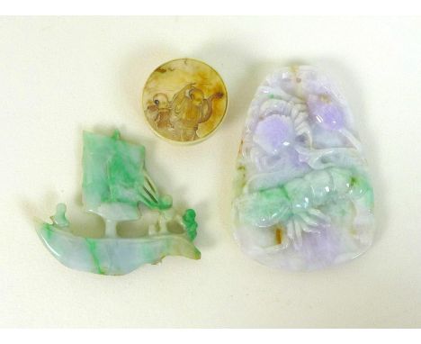 Two Chinese jade carvings, one modelled as a boat with three figures sailing it, 5cm, the other a pendant carved with a crab 