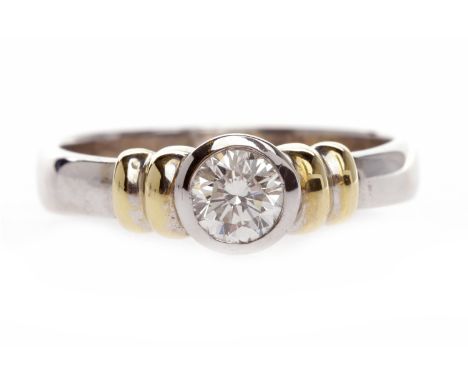 DIAMOND SOLITAIRE RINGwith a collet set round brilliant cut diamond of approximately 0.31 carats, in eighteen carat gold, siz