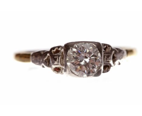 MID TWENTIETH CENTURY DIAMOND SOLITAIRE RINGwith a square collet set round brilliant cut diamond of approximately 0.50 carats