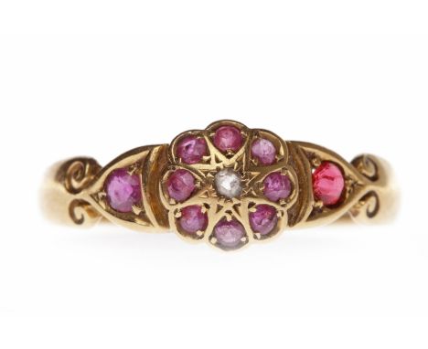 VICTORIAN EIGHTEEN CARAT GOLD RUBY AND DIAMOND DRESS RINGwith a central floral motif set with round rubies and a central roun