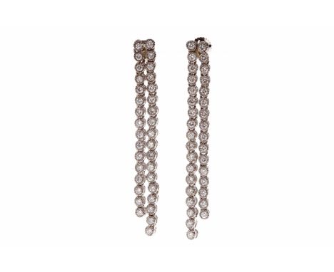PAIR OF EIGHTEEN CARAT WHITE GOLD DIAMOND DROP EARRINGSeach formed by two moveable round brilliant cut diamond set strands, t