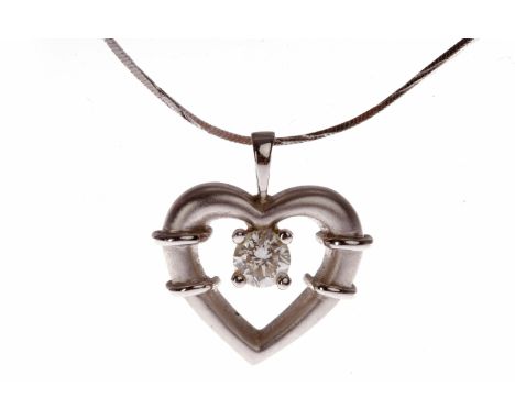 EIGHTEEN CARAT WHITE GOLD DIAMOND PENDANTin the form of a heart motif and set with a single round brilliant cut diamond of ap