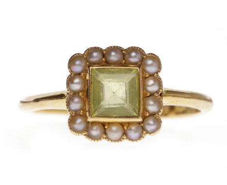 EDWARDIAN PASTE AND PEARL DRESS RINGset with a central square green paste surrounded by split pearls, unmarked, size M-N