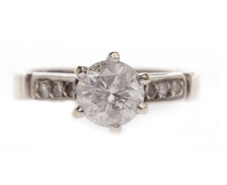DIAMOND SOLITAIRE RINGset with a round brilliant cut diamond of approximately 0.94 carats, with raised diamond set shoulders,