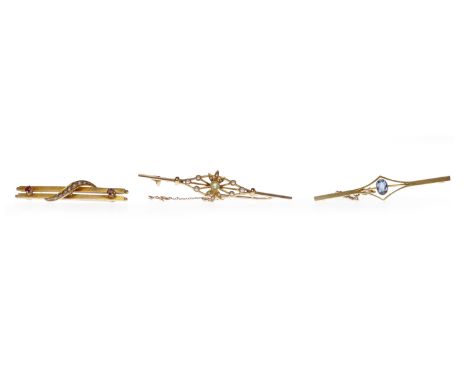 THREE EDWARDIAN BAR BROOCHEScomprising a fifteen carat gold ruby and seed pearl example, 44mm long, with a metal pin, 2g and 