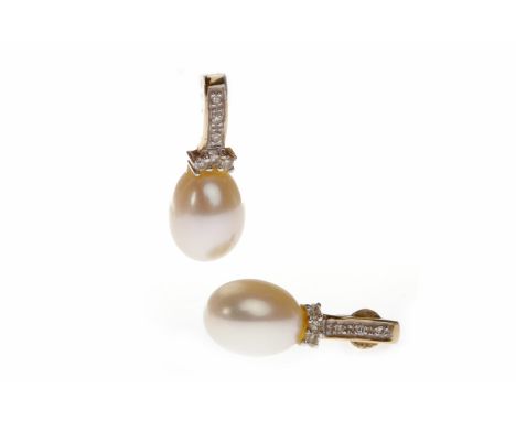 PAIR OF NINE CARAT GOLD PEARL AND DIAMOND EARRINGSeach with an ovoid white pearl 9mm long suspended from a curved diamond set