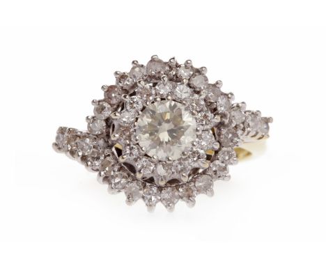 EIGHTEEN CARAT GOLD DIAMOND CLUSTER RINGthe round bezel set with a central round brilliant cut diamond of approximately 0.40 