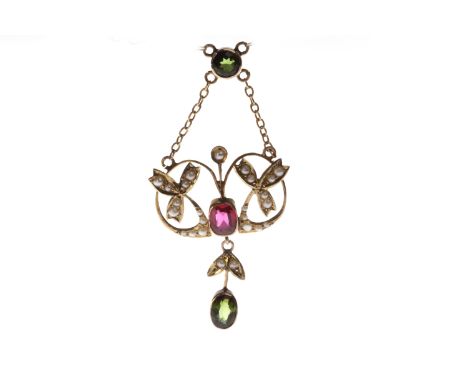 EDWARDIAN NINE CARAT GOLD GEM SET NECKLETopenwork and sinuous in form, set with a central red faceted paste within a split pe