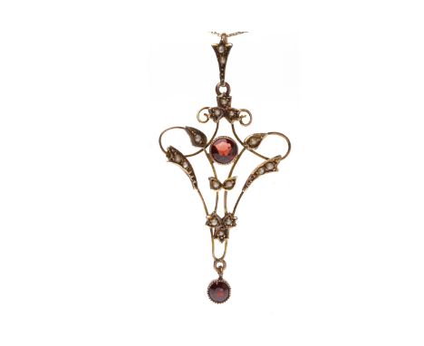EDWARDIAN GARNET AND SEED PEARL PENDANTopenwork and of sinuous form, set with two garnets and graduated seed pearls, 54mm hig