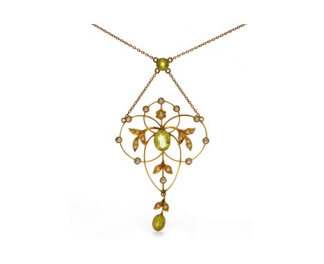 FINE EDWARDIAN GEM SET NECKLETopenwork, of sinuous form, set with two oval peridots, with seed pearl set floral and foliate m
