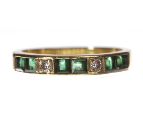 EIGHTEEN CARAT GOLD EMERALD AND DIAMOND SET BANDwith pairs of channel set emeralds interspaced by single round brilliant cut 