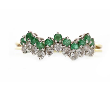 EIGHTEEN CARAT GOLD EMERALD AND DIAMOND RINGset with an undulating row of emeralds and another of diamonds, size O-P, 2.9g