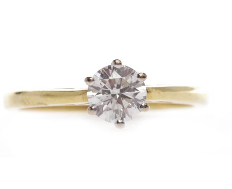 DIAMOND SOLITAIRE RINGset with a round brilliant cut diamond of approximately 0.45 carats, in eighteen carat gold, size J, 2.