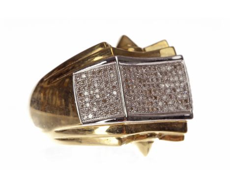 GENTLEMAN'S NINE CARAT GOLD DIAMOND RINGthe rectangular concave bezel with grain set round diamonds and flanked by two furthe