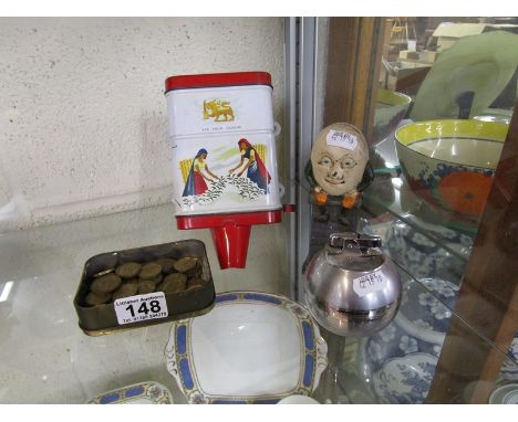 Humpty dumpty money box, Ronson lighter, tin of threepenny bits and vintage tea dispenser