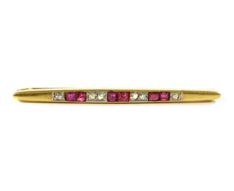 An Art Deco, gold, ruby and diamond bar brooch, square step cut rubies, possibly synthetic, channel set, alternating with ros
