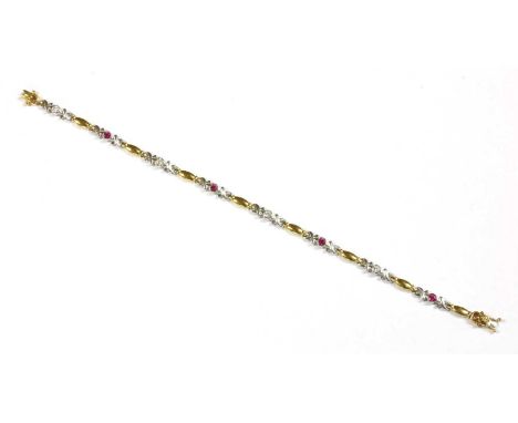 A two colour gold ruby and diamond bracelet, alternating circular mixed cut rubies and brilliant cut diamonds, rub set to pla